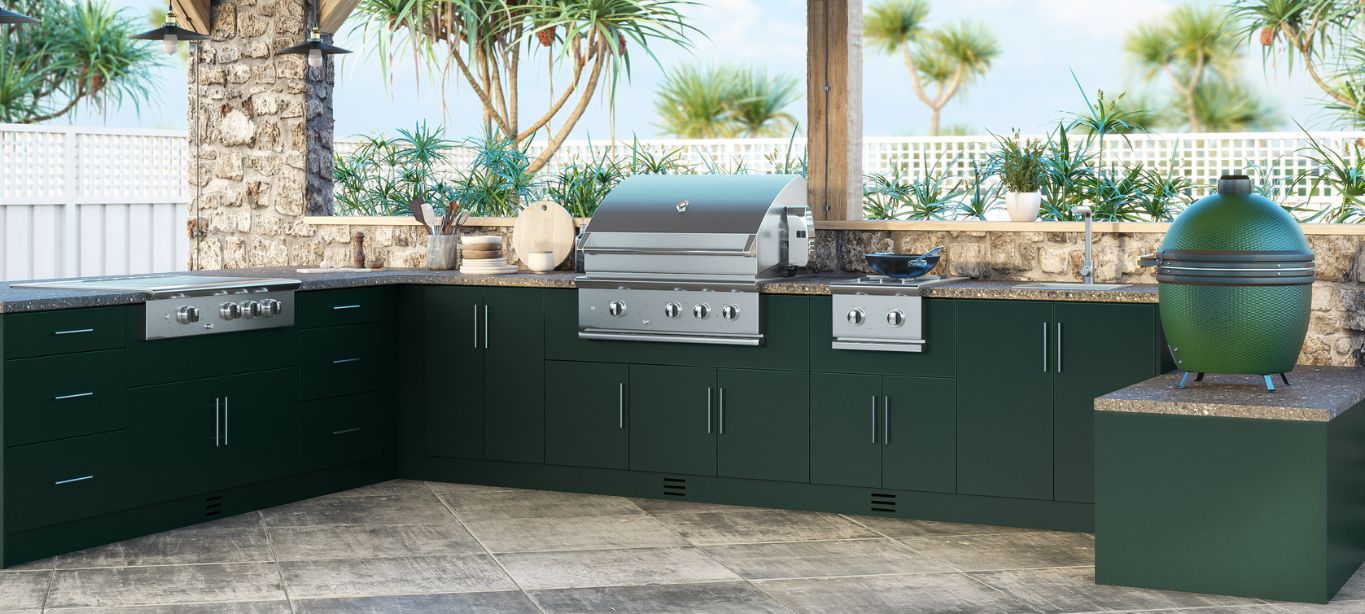 outdoor kitchen space with stove, grill, sink 
