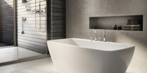 gray walls surrounding white bathtub