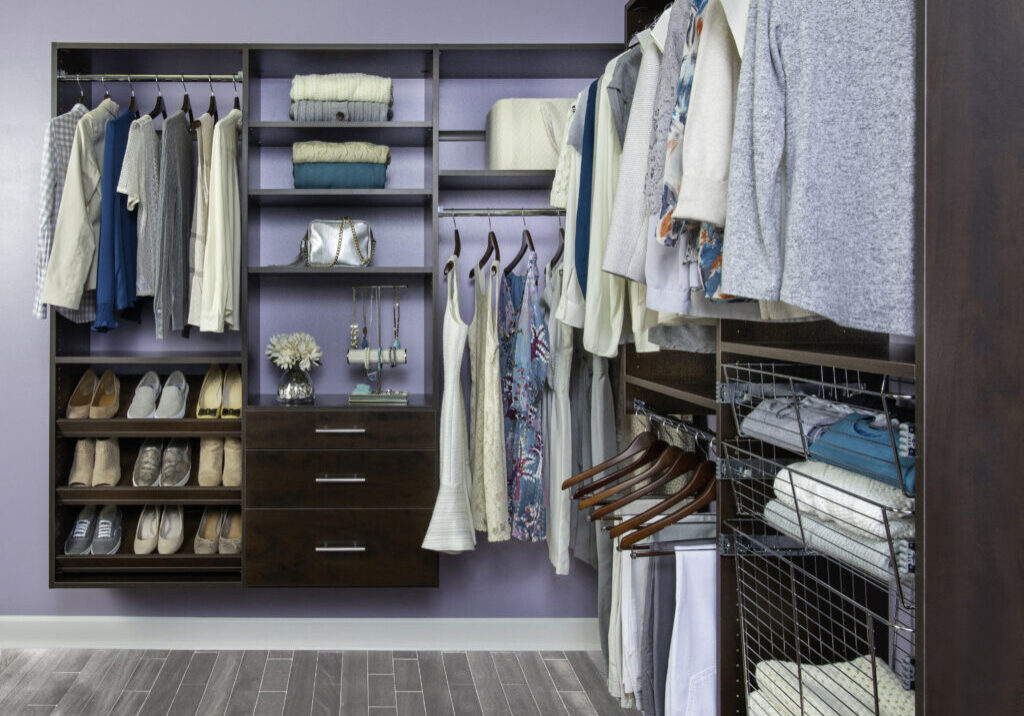 stage walk in closet with hanging clothing